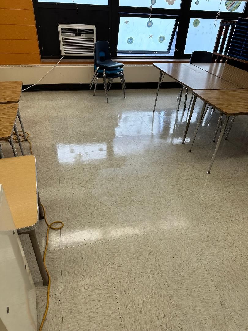 Freshly cleaned, glossy classroom floor