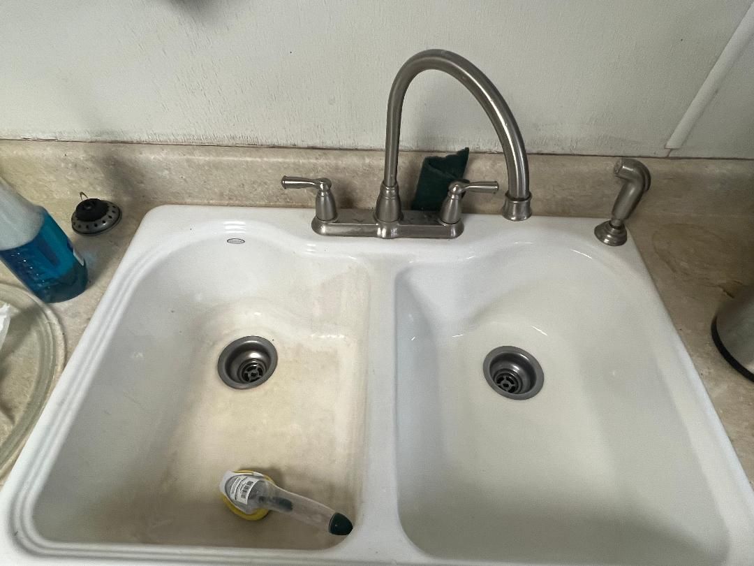 Double sink: stained basin before, cleaned basin after